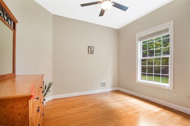 unfurnished bedroom featuring light wood-type flooring and ceiling fan