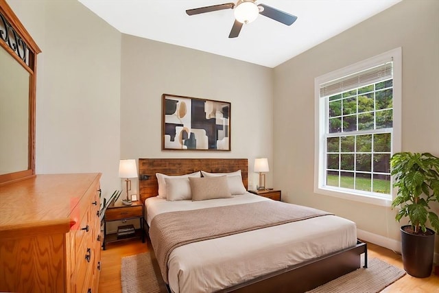 bedroom featuring ceiling fan and hardwood / wood-style flooring