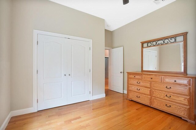 unfurnished bedroom featuring a closet and light hardwood / wood-style floors