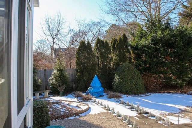 view of yard layered in snow