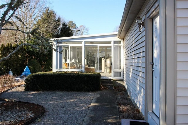 view of yard featuring a sunroom