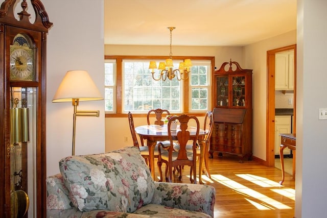 dining area featuring a chandelier and light wood-type flooring