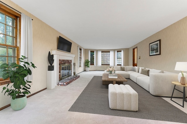 living room with light carpet and a fireplace