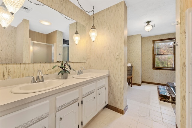 bathroom featuring vanity, tile patterned floors, and an enclosed shower