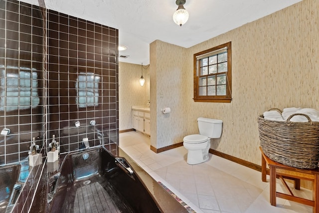 bathroom with vanity, toilet, and tile patterned flooring