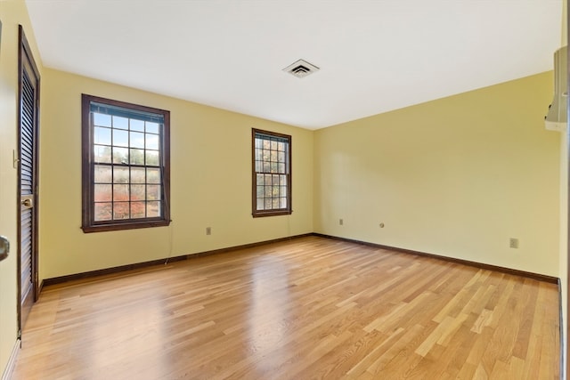 unfurnished room with light hardwood / wood-style floors