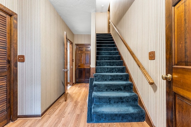 stairway with wood-type flooring