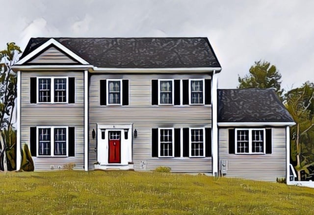 colonial house featuring a front yard