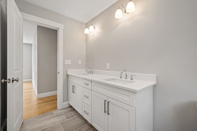 bathroom featuring vanity and hardwood / wood-style floors