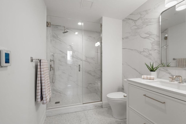 100 Linden St Unit 102, Wellesley, MA 02482 - full bathroom with a marble finish shower, vanity, and toilet