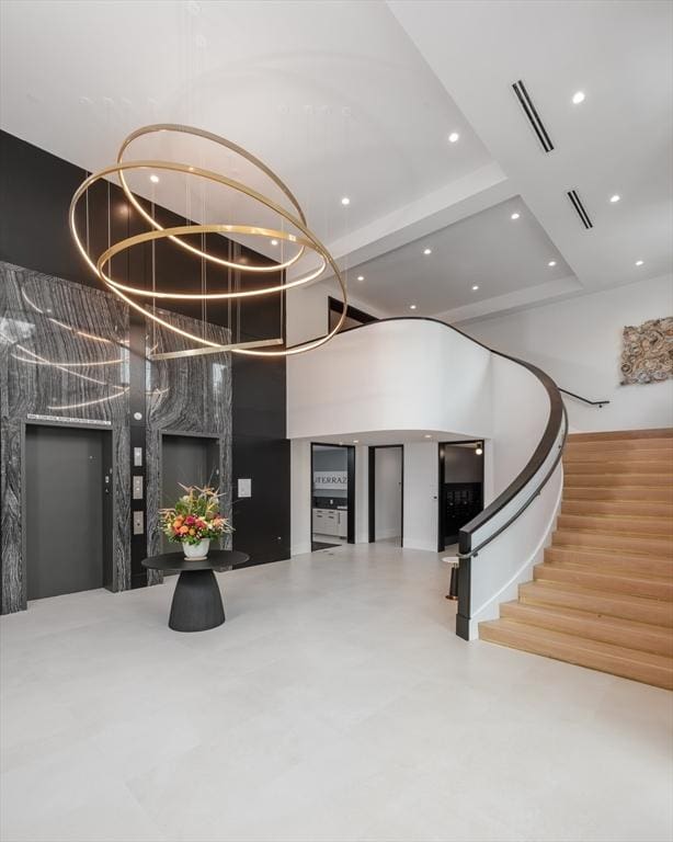 100 Linden St Unit 102, Wellesley, MA 02482 - common area featuring a high ceiling, recessed lighting, and stairway