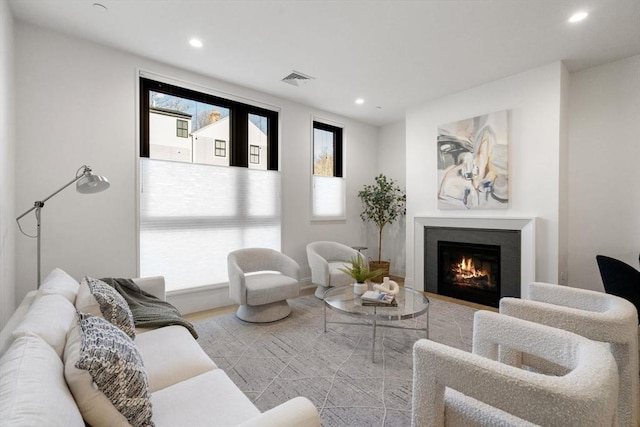 100 Linden St Unit 102, Wellesley, MA 02482 - living room with a warm lit fireplace and recessed lighting