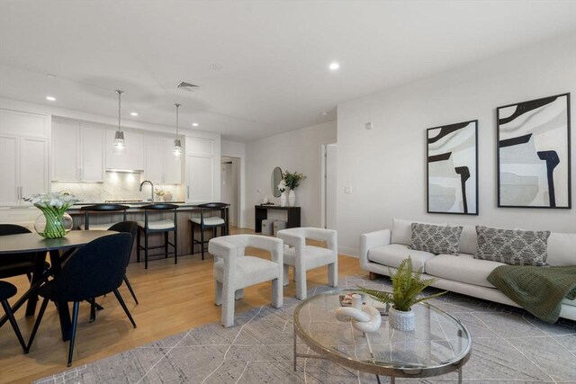 100 Linden St Unit 102, Wellesley, MA 02482 - living room with recessed lighting and light wood finished floors