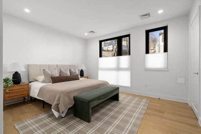 100 Linden St Unit 102, Wellesley, MA 02482 - bedroom with light wood finished floors, recessed lighting, and baseboards