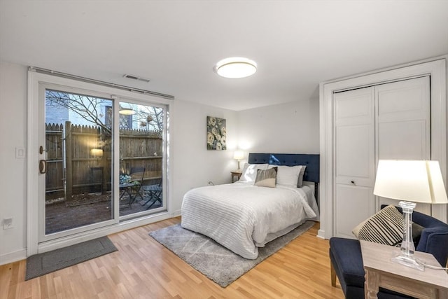 bedroom with hardwood / wood-style flooring