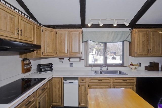 kitchen with lofted ceiling, a sink, light countertops, under cabinet range hood, and black electric stovetop