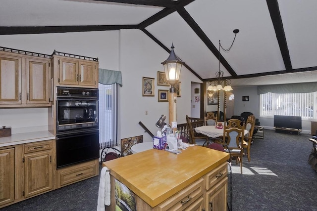 kitchen with open floor plan, beamed ceiling, a chandelier, and dobule oven black