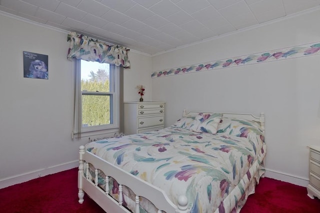 bedroom featuring crown molding, baseboards, and carpet floors