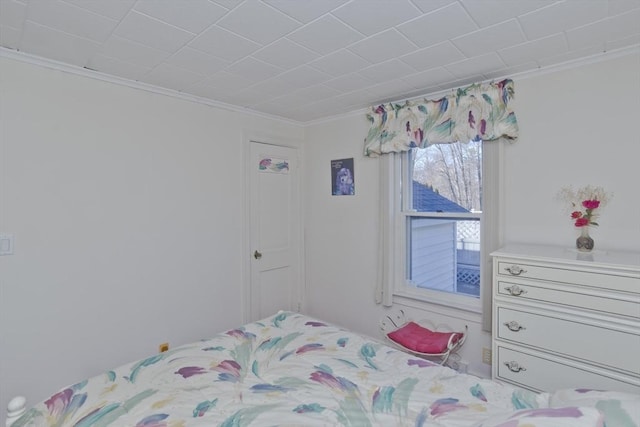 bedroom with ornamental molding