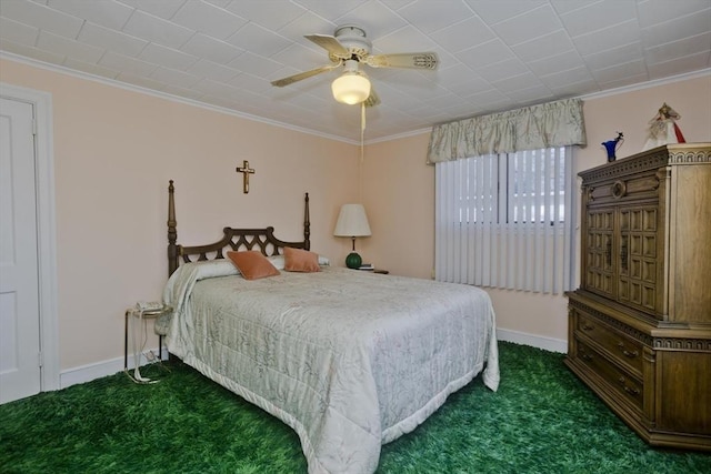 bedroom with dark carpet, a ceiling fan, baseboards, and ornamental molding