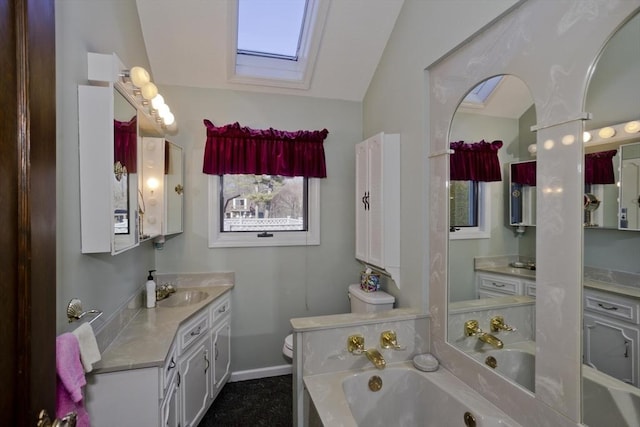 bathroom with a wealth of natural light, vaulted ceiling with skylight, toilet, and a garden tub