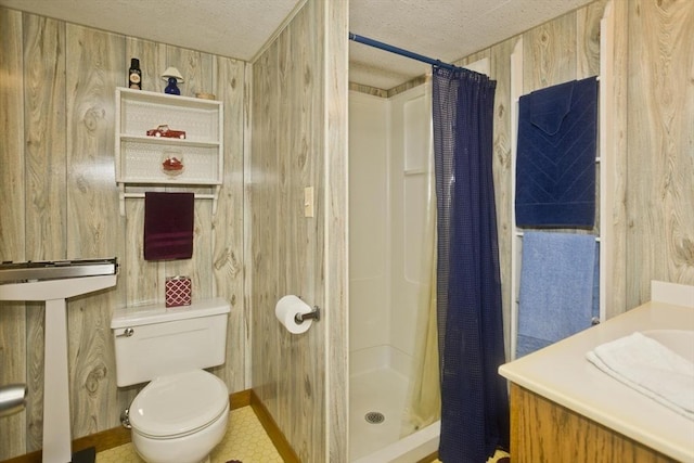 full bathroom with a textured ceiling, a stall shower, wood walls, and toilet