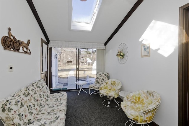 sunroom / solarium with vaulted ceiling with skylight