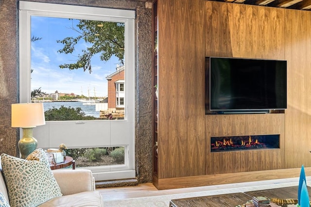 living area with a glass covered fireplace