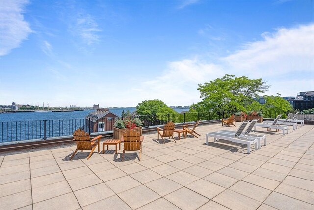 view of patio featuring a water view