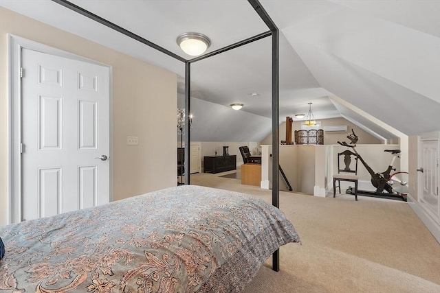 bedroom featuring vaulted ceiling and carpet floors