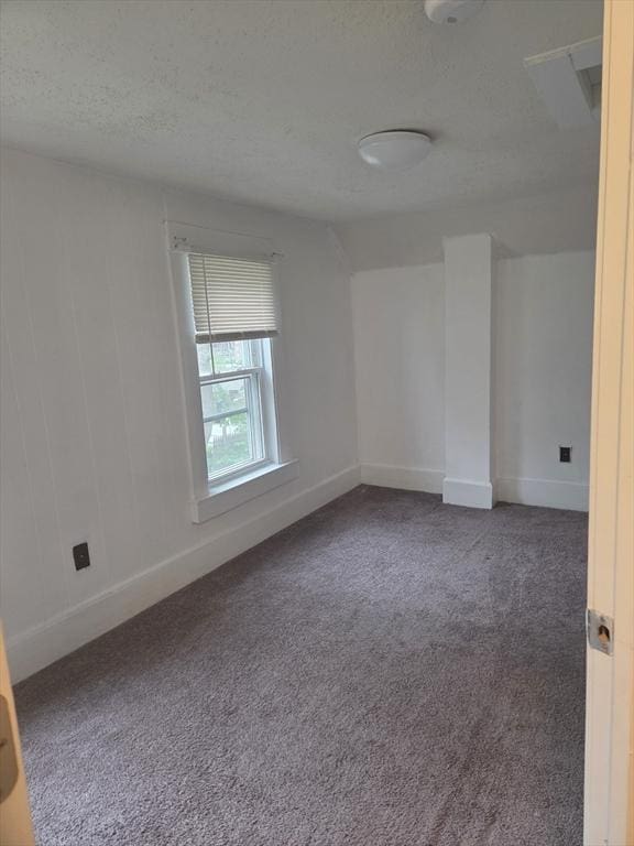 288 Quincy St, Springfield, MA 01109 - empty room featuring carpet floors and a textured ceiling