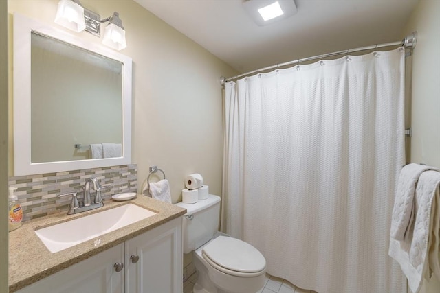 bathroom with toilet, vanity, decorative backsplash, and a shower with curtain