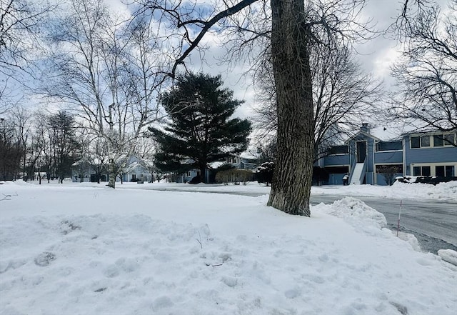 view of yard layered in snow