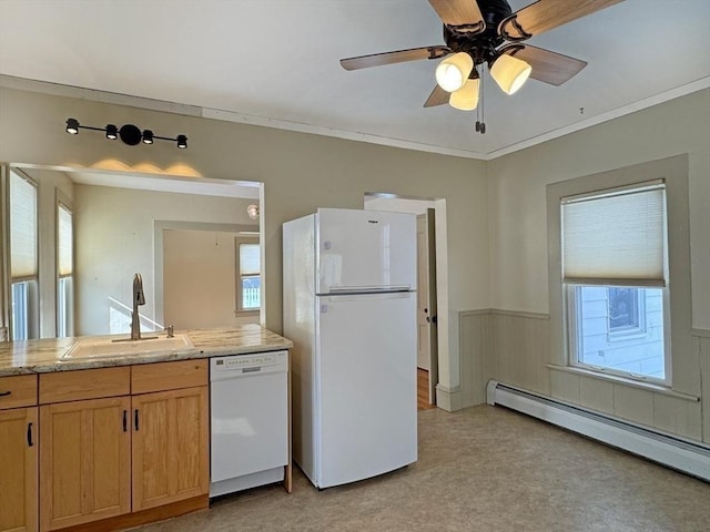 kitchen with sink, ceiling fan, baseboard heating, crown molding, and white appliances