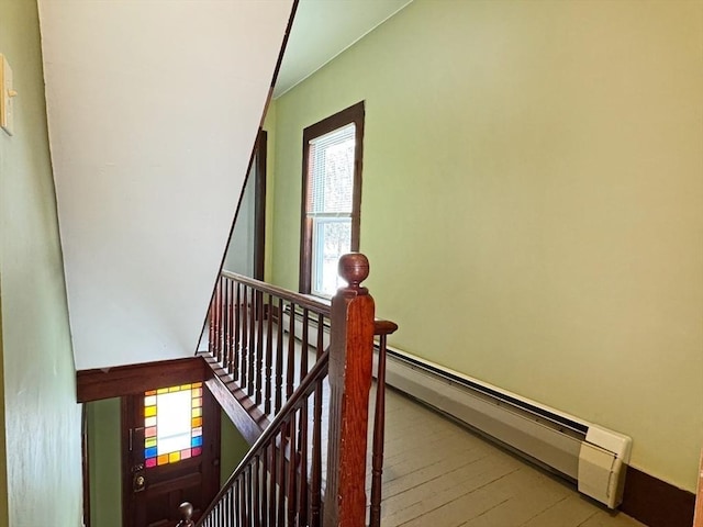 stairway with wood-type flooring