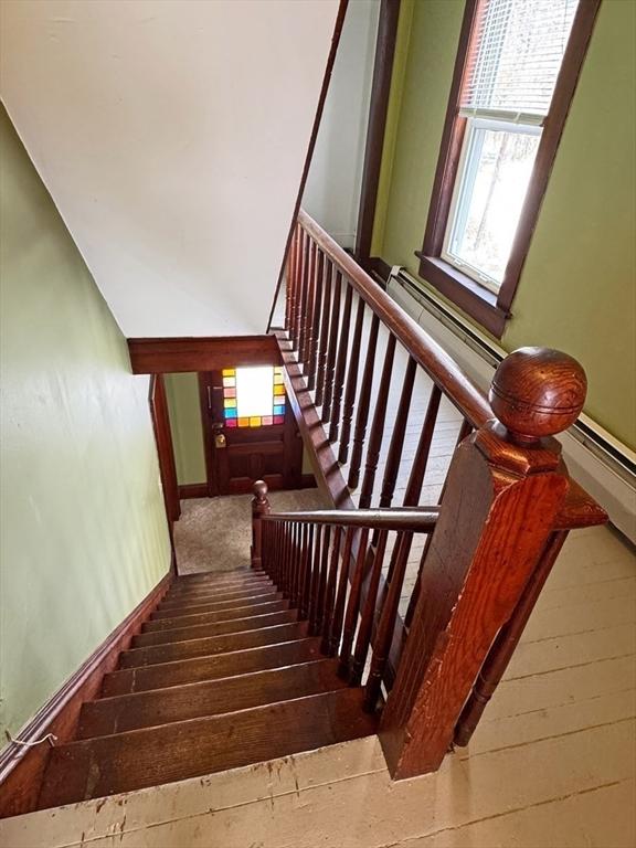 staircase featuring hardwood / wood-style flooring