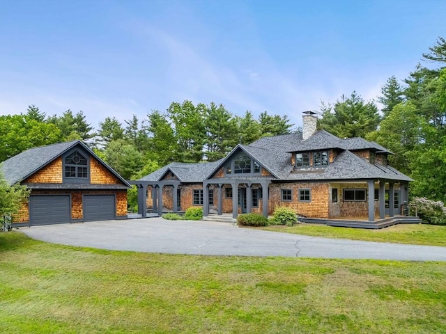 7 Penhollow Ln, Hampton Falls, NH 03844 - shingle-style home with a porch, a front lawn, a chimney, and an outbuilding