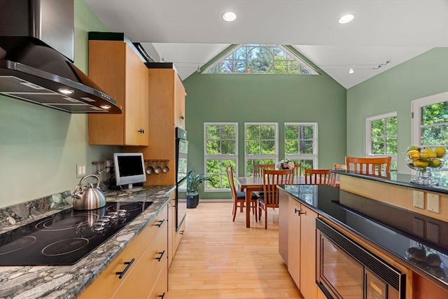 7 Penhollow Ln, Hampton Falls, NH 03844 - kitchen featuring wall chimney exhaust hood, black appliances, light wood-style flooring, dark stone countertops, and recessed lighting
