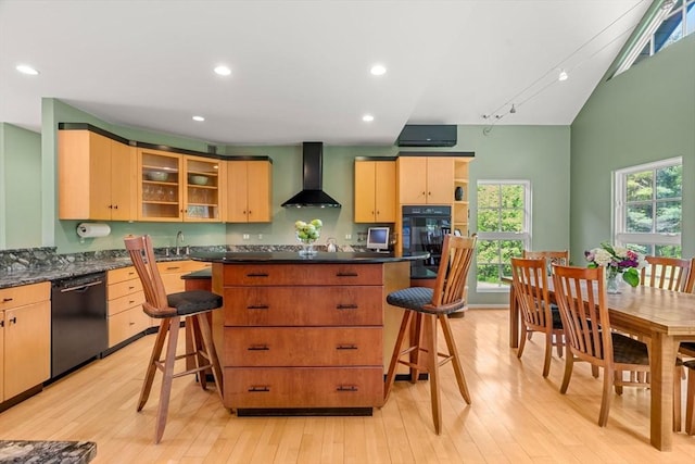 7 Penhollow Ln, Hampton Falls, NH 03844 - kitchen with wall chimney exhaust hood, black appliances, a kitchen island, light wood-style floors, and dark countertops