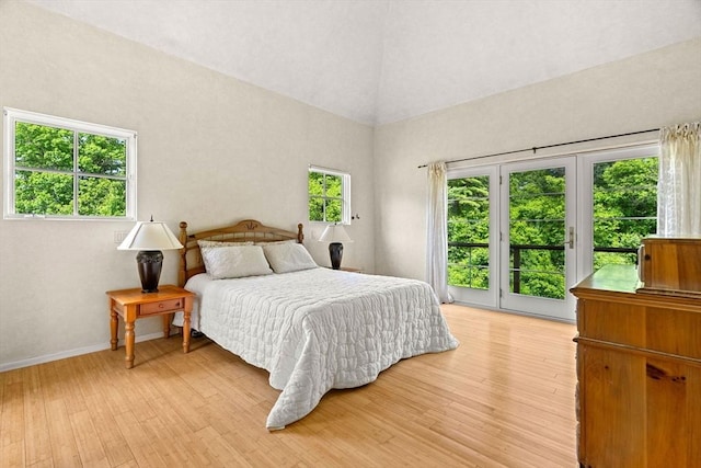7 Penhollow Ln, Hampton Falls, NH 03844 - bedroom featuring access to outside, light wood-type flooring, vaulted ceiling, and baseboards