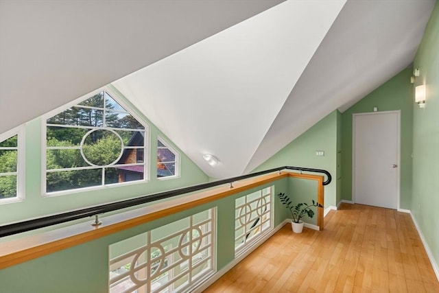 7 Penhollow Ln, Hampton Falls, NH 03844 - corridor with lofted ceiling, plenty of natural light, baseboards, and hardwood / wood-style flooring