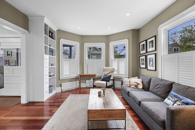 living room featuring baseboards, recessed lighting, and dark wood-type flooring