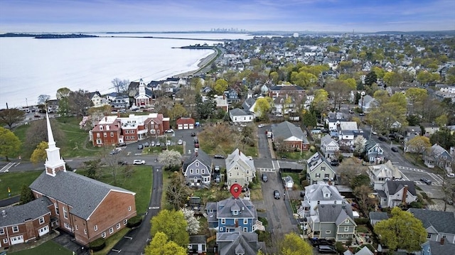 birds eye view of property featuring a water view and a residential view