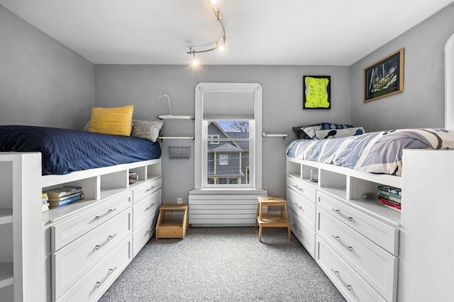 bedroom featuring light colored carpet