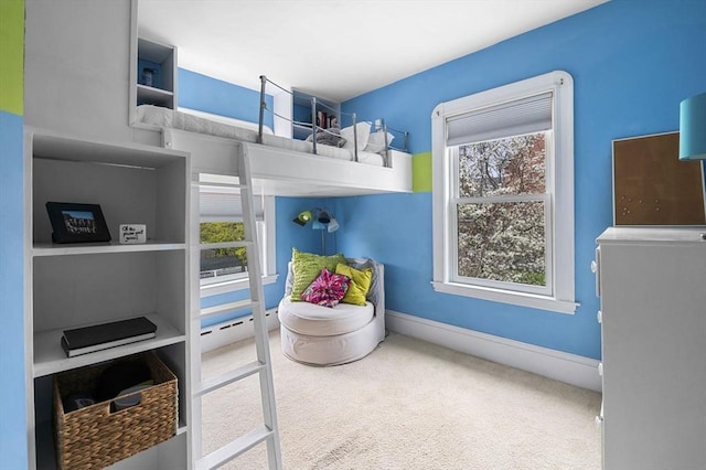 carpeted bedroom with baseboards and multiple windows