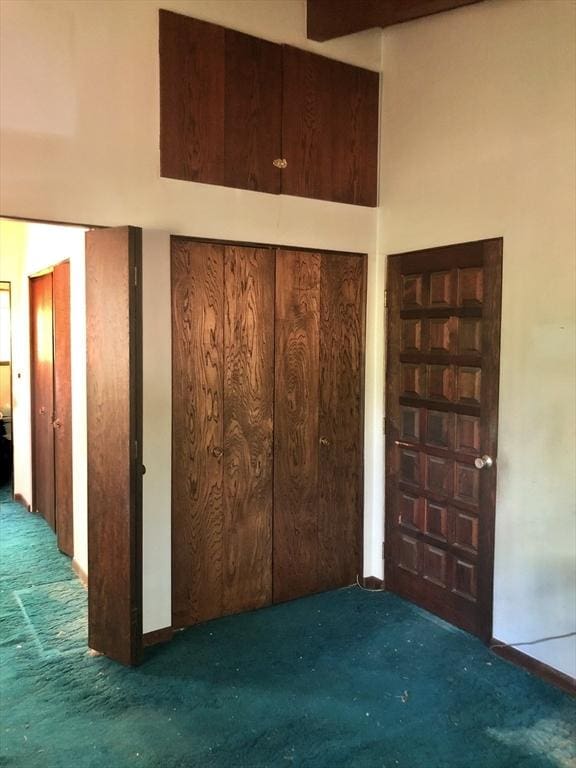 unfurnished bedroom with carpet flooring