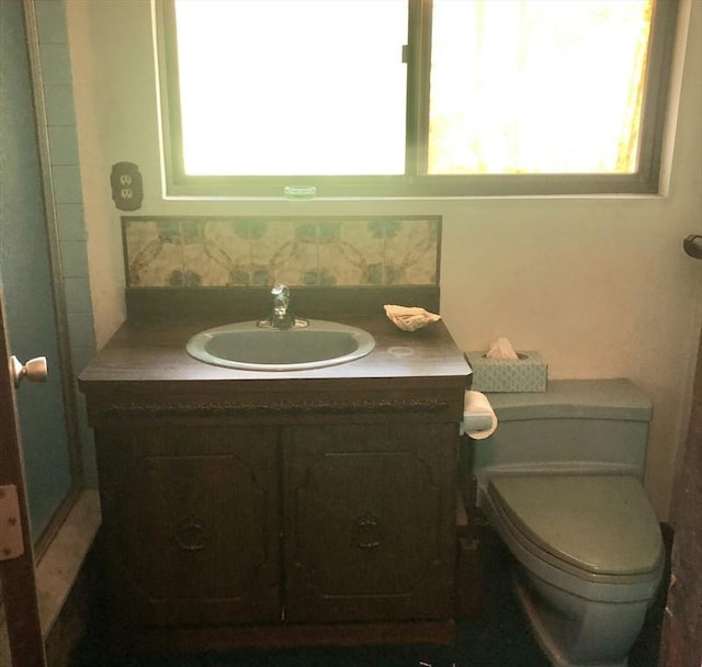 bathroom featuring vanity and toilet