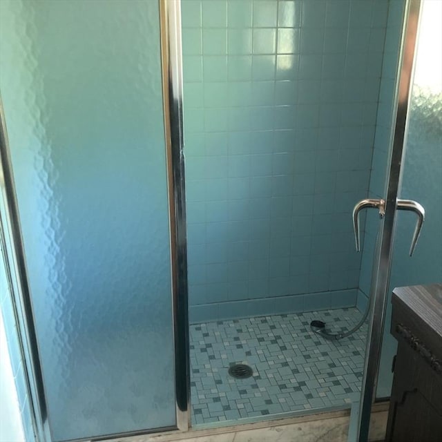 full bath with a shower stall