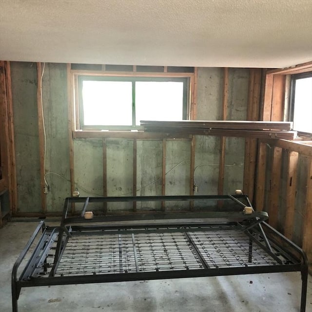 below grade area with a textured ceiling