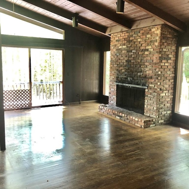 unfurnished living room featuring wooden ceiling, a fireplace, and hardwood / wood-style flooring